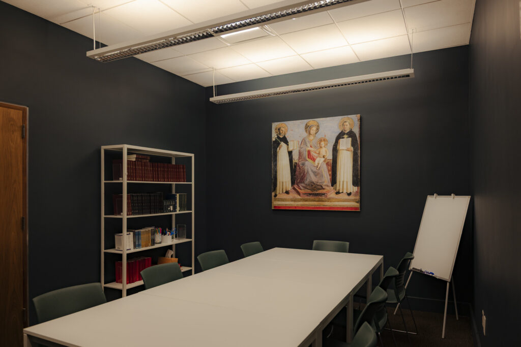 Meeting room with a table surrounded by chairs at The Catholic Center at NYU